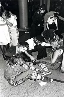 Images Dated 17th September 1976: Music - Pop - Bay City Rollers - Hysterical fans are tended by St John Ambulance members