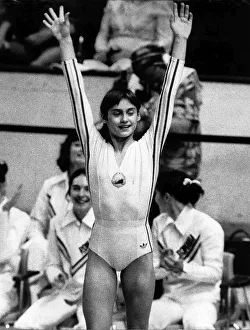 Gymnast Prints: Nadia Comaneci July 1976 Romanian genius No 73 ia applauded by her team mates as