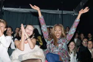 Award Prints: Naomi Campbell model sitting next to supermodel Kate Moss cheers a winner at British