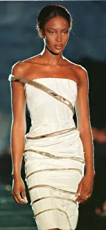 Supermodel Prints: Naomi Campbell modelling white strapless evening dress as part of Donatella Versace