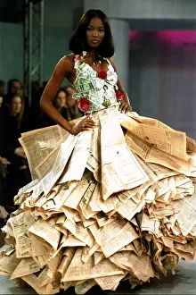 Naomi Campbell wearing a newspaper and money dress at the Clothing Brition Fashion Show