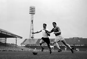 Nat lofthouse of Bolton Wanderers is challenged for the ball by Manchester United