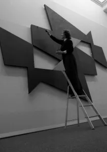 Natalie Dower puts the finishing touches to her exhibition piece at the Mead Gallery