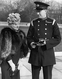 Medals Prints: National Fire Service District Officer Ronnie Greene with his wife leaving Buckingham