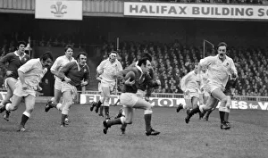 5 Nations Prints: Five Nations 1977. England v Wales. Welsh captain Phil Bennett running with
