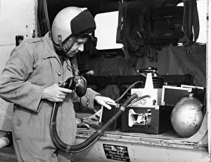 Air Force Prints: Navigator Steve Cawthorne of 202 Search and Rescue Squadron checks over the oxygen