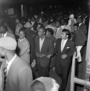 01167 Prints: Nearly 1000 West Indian immigrants arrive in three boats trains at Waterloo Station