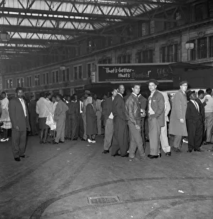 01167 Prints: Nearly 1000 West Indian immigrants arrive in three boats trains at Waterloo Station
