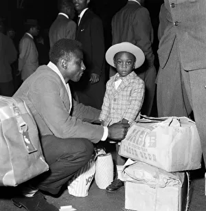 01167 Prints: Nearly 1000 West Indian immigrants arrive in three boats trains at Waterloo Station
