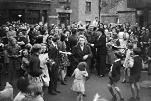 Neighbours greet Alfred Mansford (note : spelling on caption hard to read)