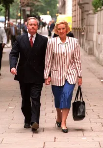 Neil Hamilton former MP for Tatton with his wife Christine near Millbank Westminster