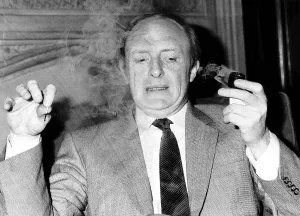 Neil Kinnock ex-MP and Leader of the Labour Party smoking a pipe at the House of Commons