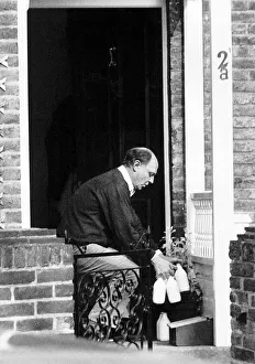 Neil Kinnock MP Former Labour Party Leader outside his house taking in his delivered milk