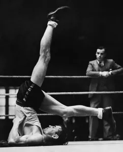Nel Tarleton upside down cycling, keeping his limbs supple whilst training in the gym for