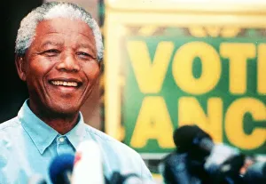 Poster Prints: Nelson Mandela seen here campaigning during the South African elections standing beside a
