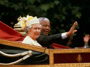 World Leaders Prints: Nelson mandela waves from the carriage as he sits beside Her Majesty Queen Elizabeth II