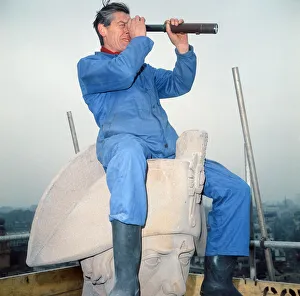 Nelsons Column being cleaned. Cleaner Ted Chambers on top of Nelsons Head