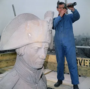 Nelsons Column being cleaned. Cleaner Ted Chambers taking a break to survey