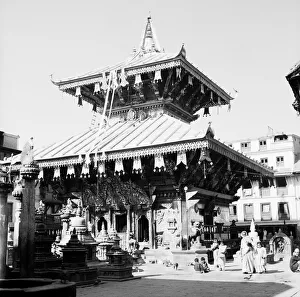Buddhism Prints: Nepalese children playing around the a Buddhist Temple in Katmandu the capital of