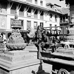 Buddhism Prints: Nepalese children playing around the Changnarayan Temple in Katmandu the capital of