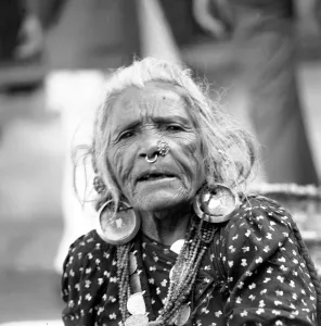 Nepalese woman seen here wearing a Tamang Nose-Ring and large ear rings in a Katmandu
