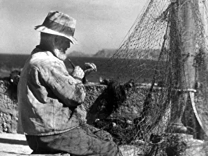 Repairing Prints: Net making, a fisherman in Cornwall, circa January 1944