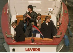 Take That in the Netherlands after their final concert, leaving on a canal tazi as fans