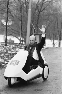 The New Electric Vehicle Sir Clive Sinclair in his new electric vehicle