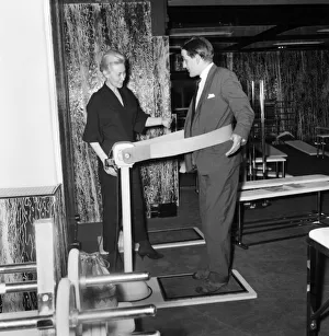 New Gymnasium opens in Oxford Street, London. A potential gym member trys out one of