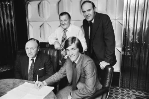 New Liverpool signing Kenny Dalglish with manager Bob Paisley at Anfield as he completes