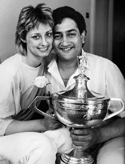 New snooker World Champion Joe Johnson holds on to the trophy with his wife Terryll