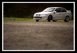 00143 Prints: NEW VAUXHALL GSI CAR SILVER ALLOY WHEELS JULY 1999 FOR ROAD RECORD