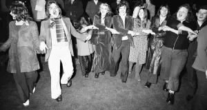 Holding Hands Prints: New Year Revellers seeing in 1973 in Centenary Square Birmingham sing Auld Lang Syne