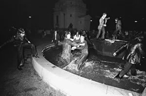 New Year Revellers seeing in 1973 by taking a quick dip in the fountain in Centenary