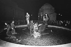 00744 Prints: New Year Revellers seeing in 1973 by taking a quick dip in the fountain in Centenary