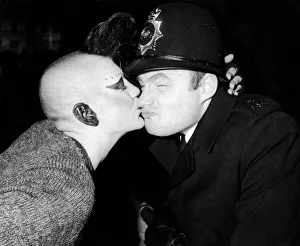 Makeup Prints: New Years Reveller 1984. So Friendly: A policeman is kissed by a girl punk, Beccy Massey