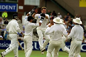 Kiwi Prints: New Zealand Pace Bowler Dion Nash Is Mobbed By Team-Mattes After Trapping Graeme Hick Lbw