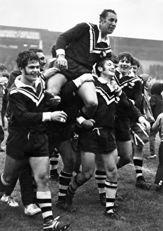 New Zealand players carry off their captain Roy Christian after beating Great Britain in