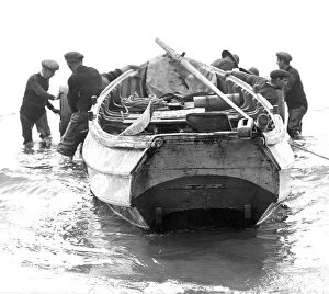 Newbiggin fishermen prepare to beach their craft, after the morning