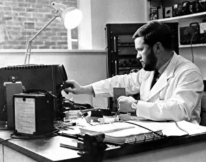 01194 Prints: Newcastle General Hospital. An electronic technician tests neurophysiology apparatus in