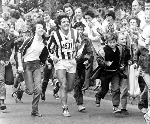 Newcastle player Kevin Keegan is joined by supporters on the Great North Run, in 1981