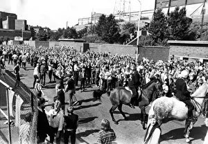 Newcastle Supporters - Police on horse back control the Newcastle supporters outside St