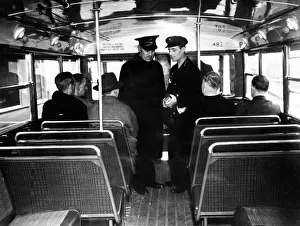 Conductor Prints: Newcastle Trolley Bus, two people can pass easily in the gangway of this new bus