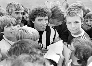 Newcastle United footballer Kevin Keegan is surrounded by young Newcastle fans during a