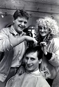 01521 Collection: Newcastle United player Glenn Roeder pictured receiving a hair cut from team mate Paul