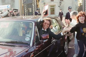 Knighthood Prints: A newly-knighted Sir Cliff Richard leaves Buckingham Palace waving his gong aloft