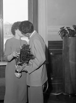 00082 Prints: A newly married Russian couple kissing in the registrar office in Leningrad