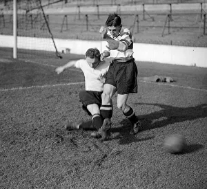 Magicfeet Prints: Bill Nicholson of Tottenham Hotspur performs a sliding tackle on teammate Freddie Cox