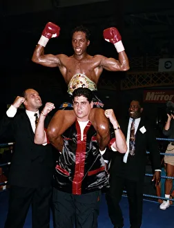 Nigel Benn Boxing hoisted shoulder high by trainer Jimmy Tibbs