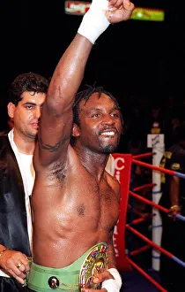 Nigel Benn celebraters his victory over Vincenzo Nariello in defence of his WBC super